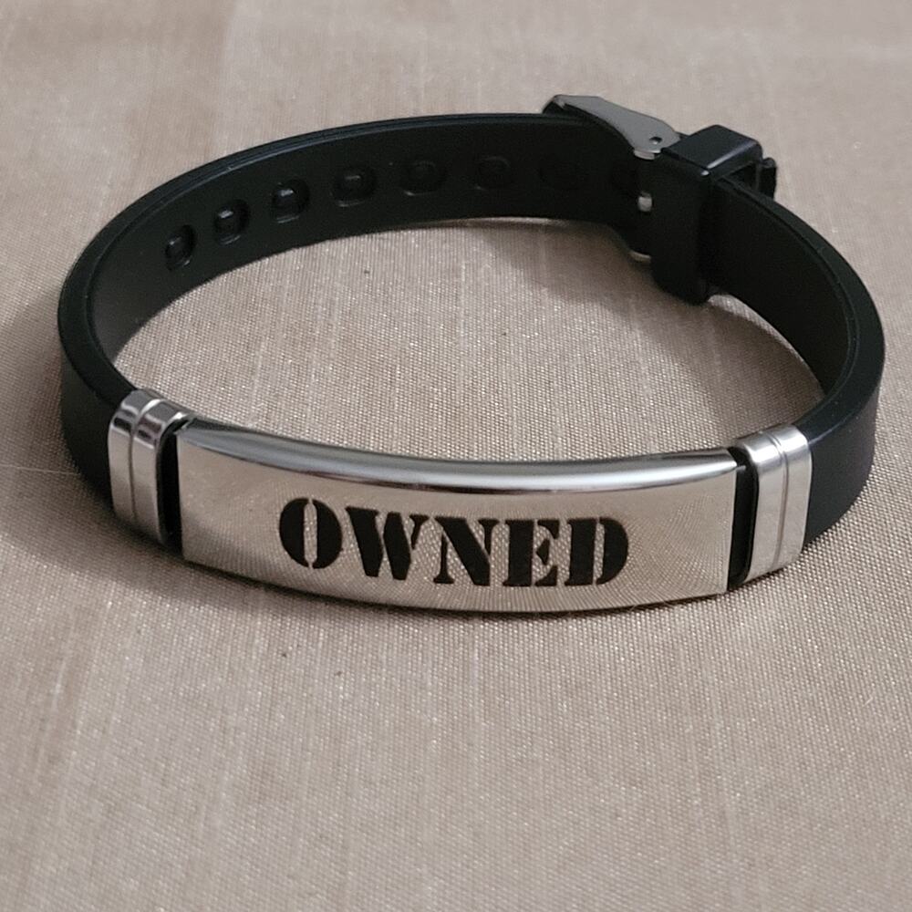 "Owned" engraved stainless steel & black silicone buckle bracelet